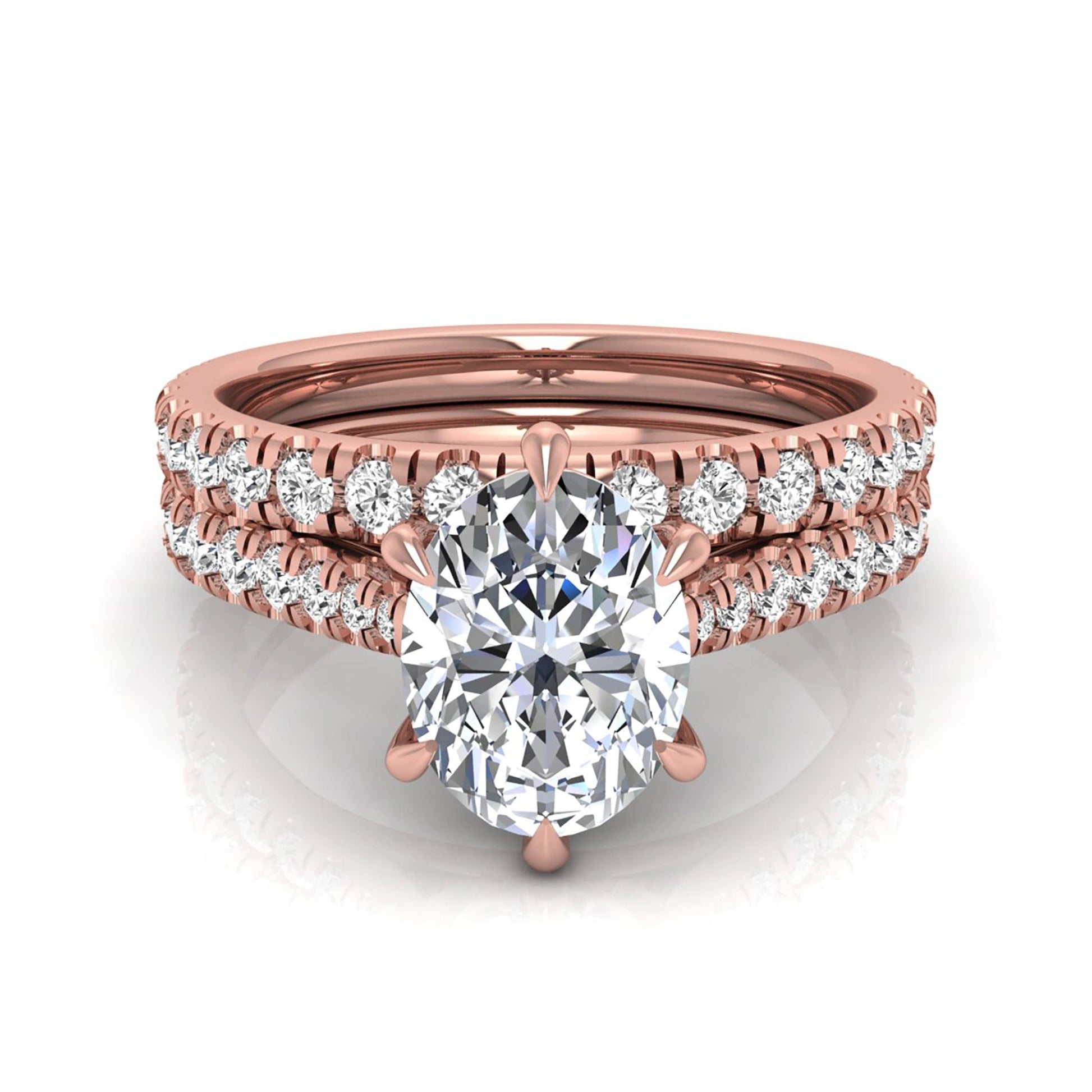 Oval cut lab grown diamond bridal ring set with pavé engagement ring and matching diamond wedding band in rose gold style.