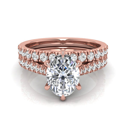 Oval cut lab grown diamond bridal ring set with pavé engagement ring and matching diamond wedding band in rose gold style.
