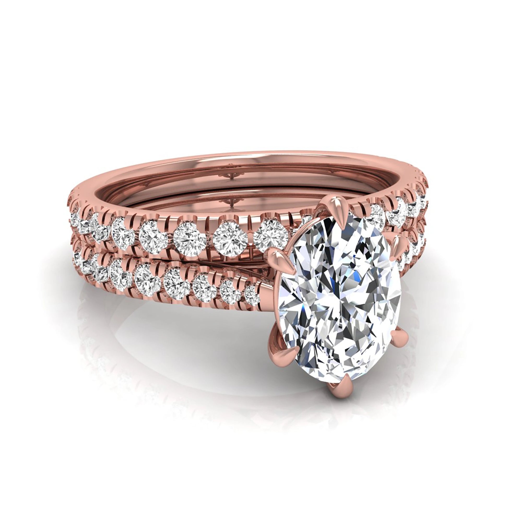 Oval cut lab grown diamond bridal ring set with pavé engagement ring and matching diamond wedding band in rose gold style.