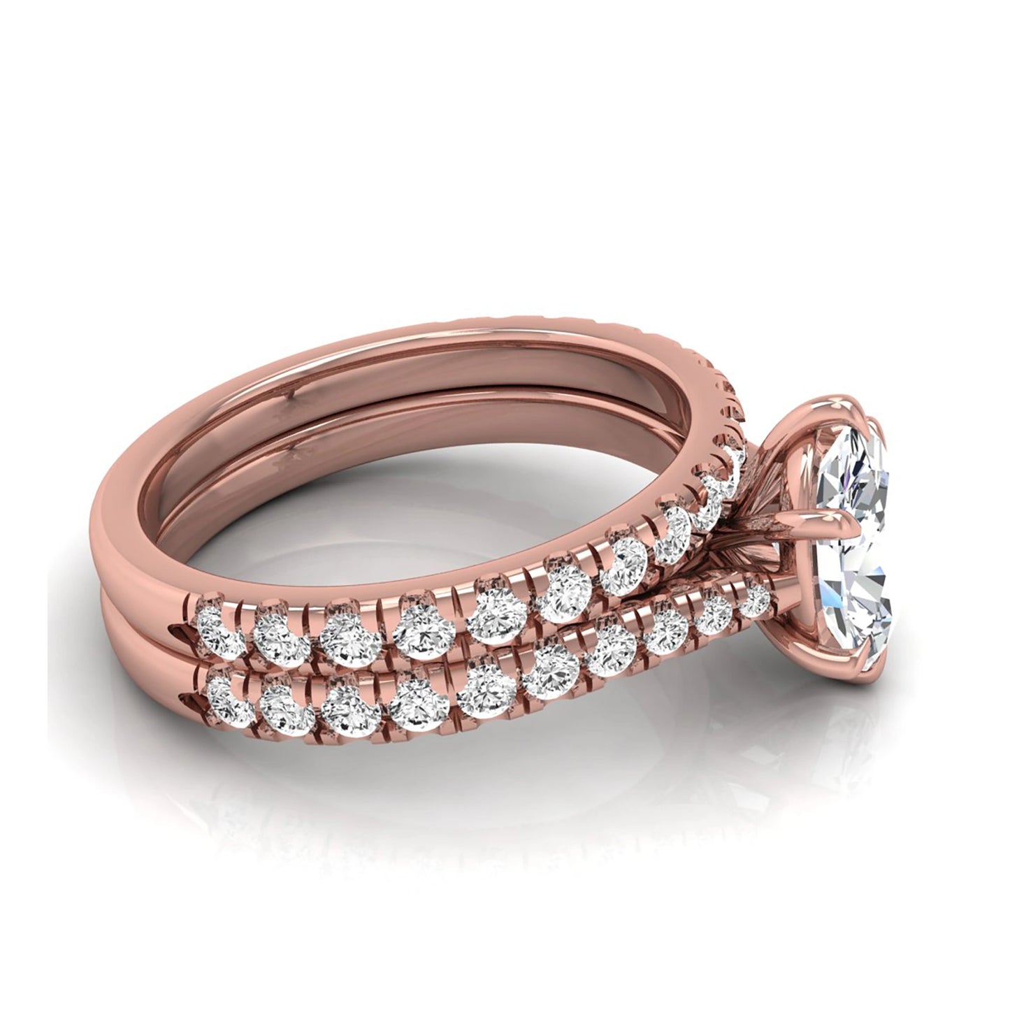 Oval cut lab grown diamond bridal ring set with pavé engagement ring and matching diamond wedding band in rose gold style.