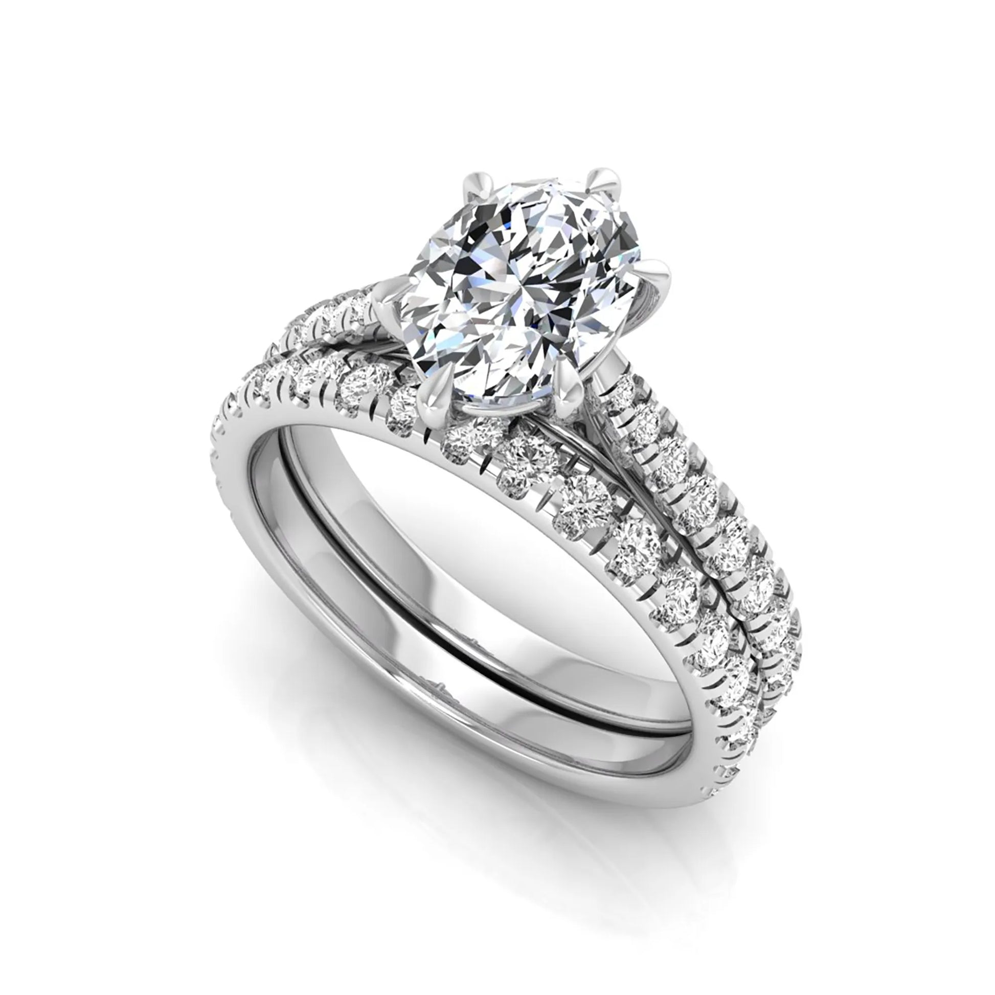 Oval cut lab grown diamond bridal ring set with pavé engagement ring and matching diamond wedding band in yellow gold style.
