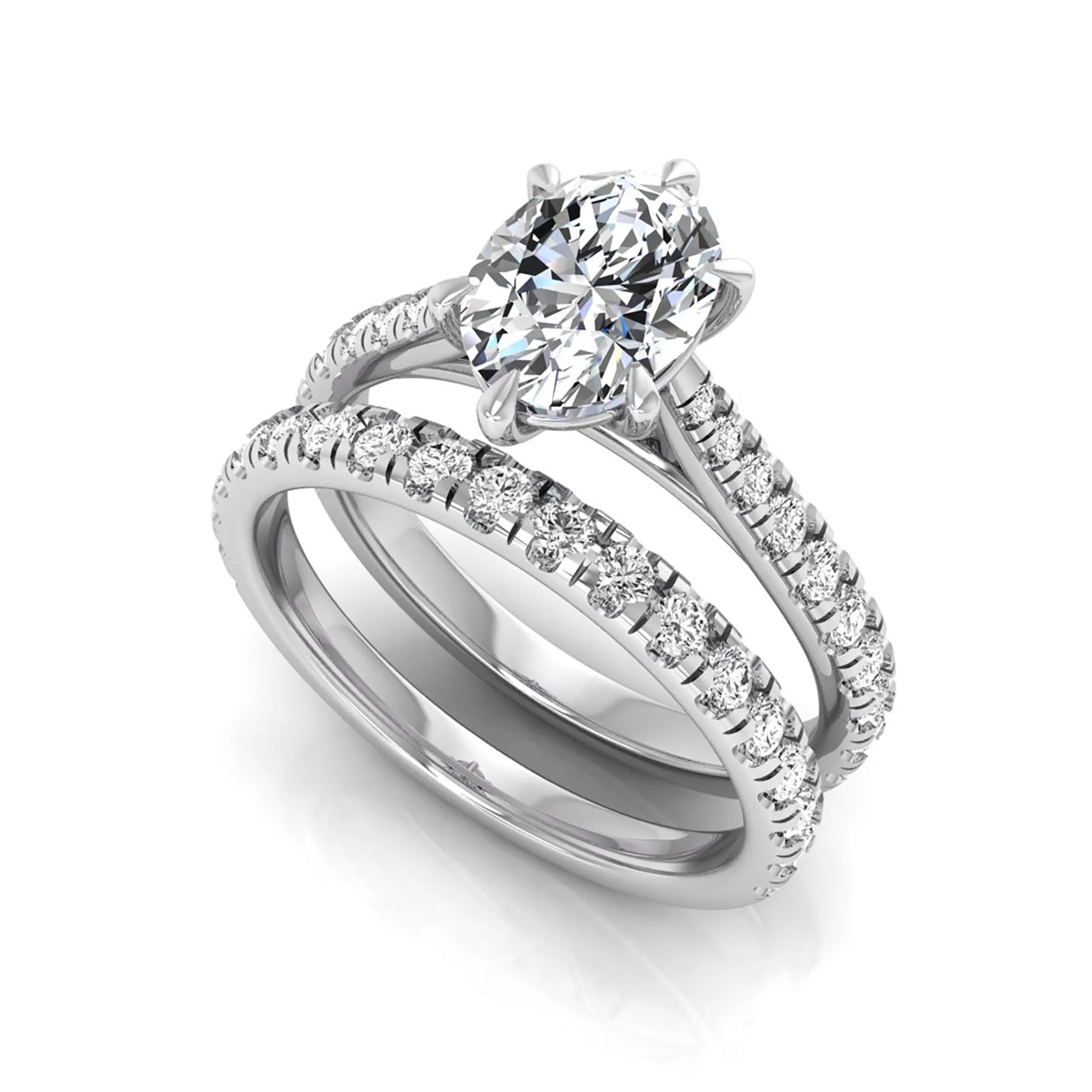 Oval cut lab grown diamond bridal ring set with pavé engagement ring and matching diamond wedding band in white gold style.