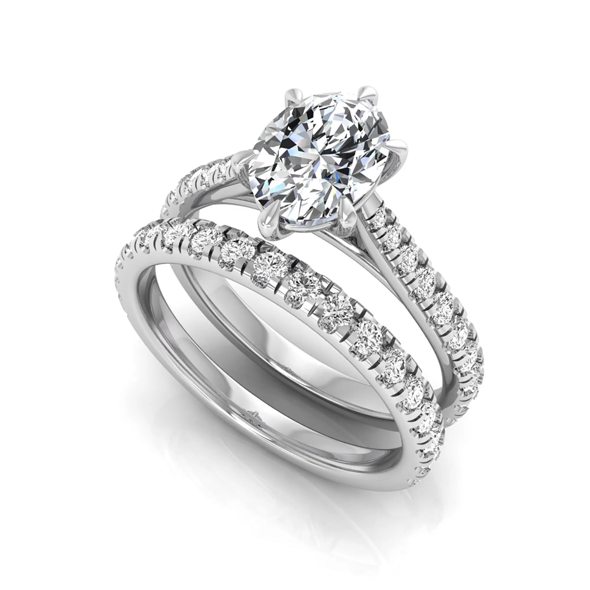Oval cut lab grown diamond bridal ring set with pavé engagement ring and matching diamond wedding band in white gold style.