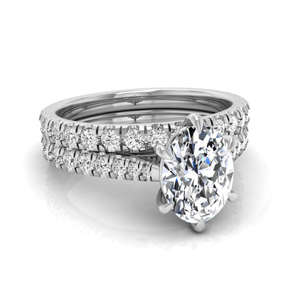Oval cut lab grown diamond bridal ring set with pavé engagement ring and matching diamond wedding band in white gold style.