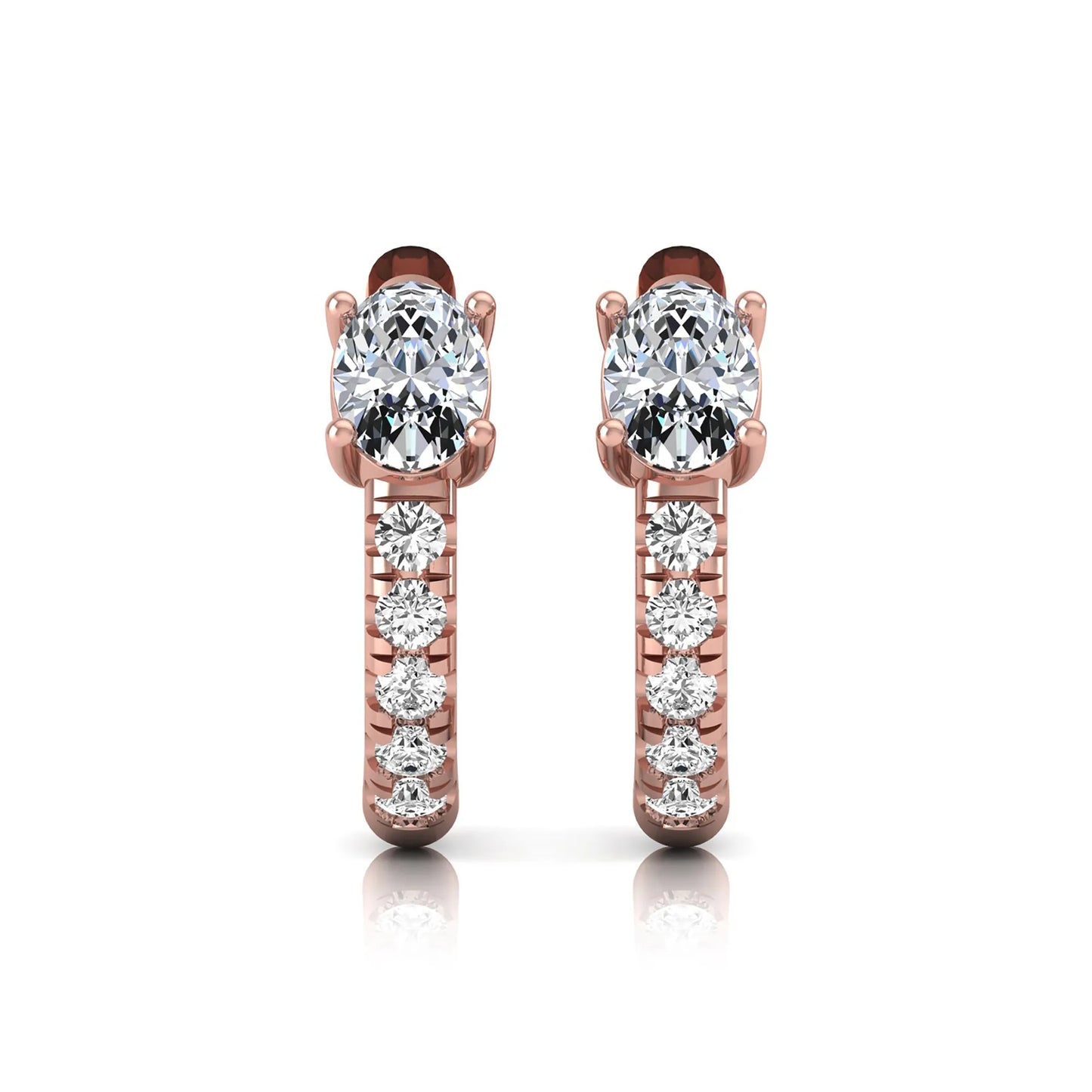 Oval cut lab grown diamond huggie hoop earrings featuring a four prong basket set center diamond with graduated round brilliant pavé diamonds on a rose gold hoop.