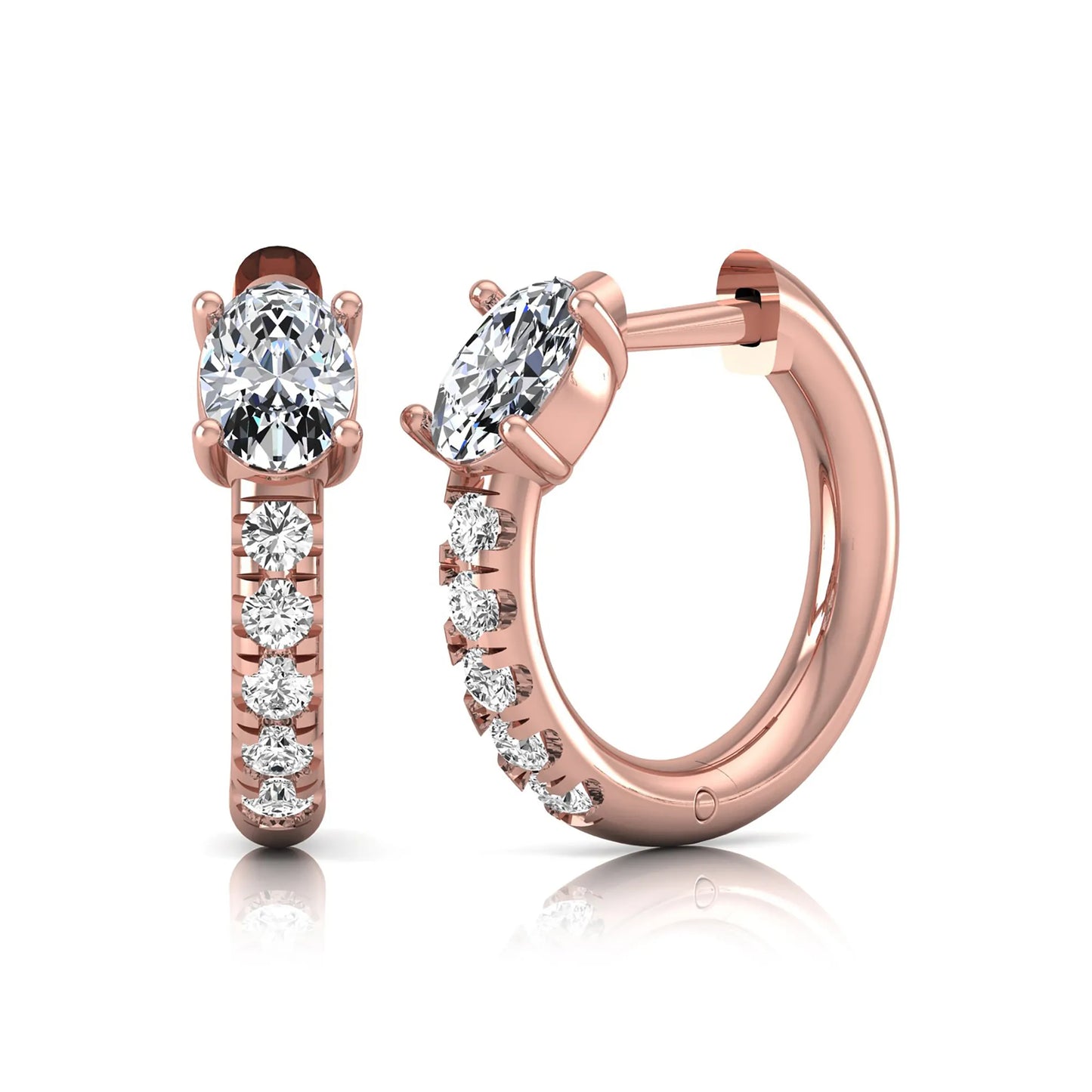 Oval cut lab grown diamond huggie hoop earrings featuring a four prong basket set center diamond with graduated round brilliant pavé diamonds on a rose gold hoop.