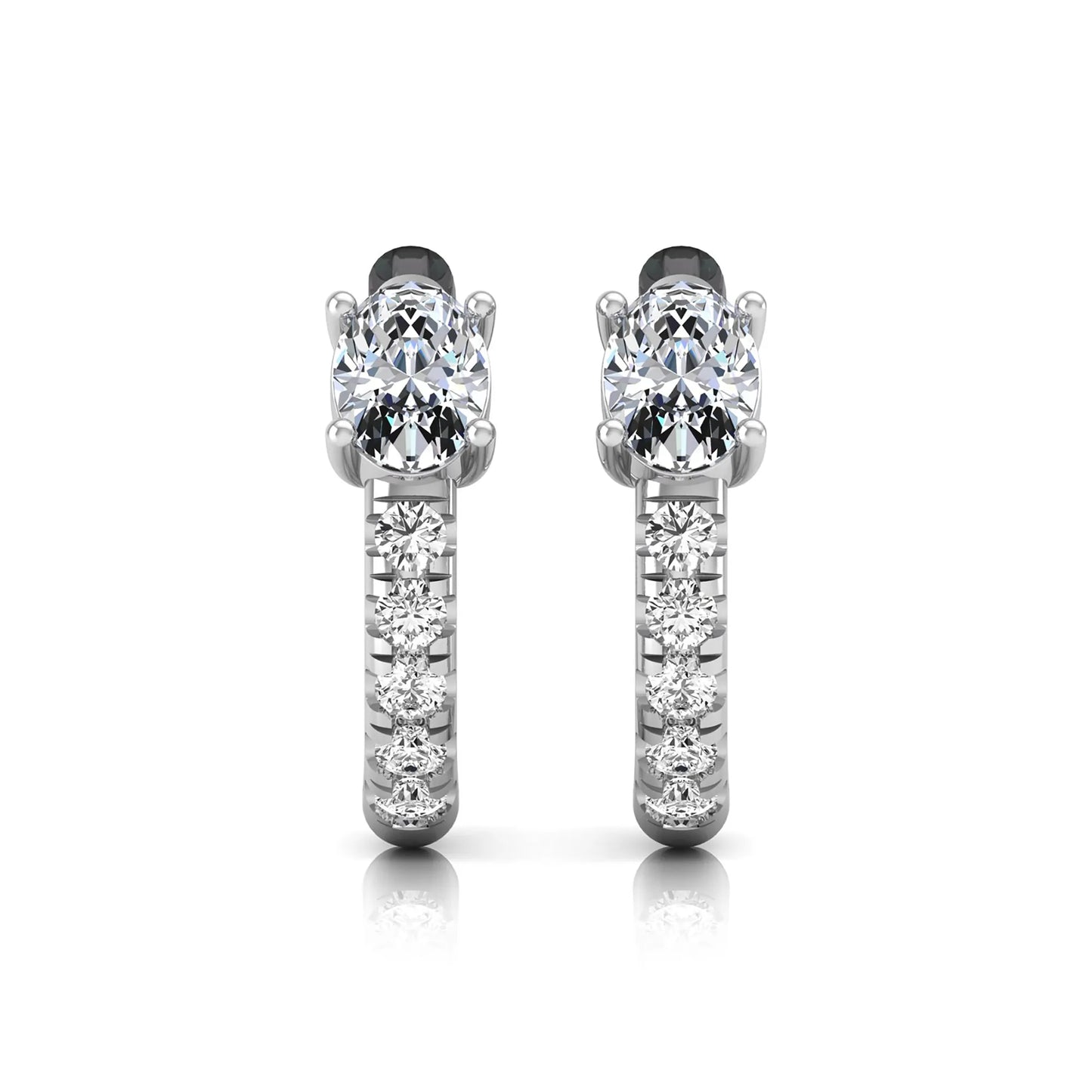Oval cut lab grown diamond huggie hoop earrings featuring a four prong basket set center diamond with graduated round brilliant pavé diamonds on a white gold hoop.