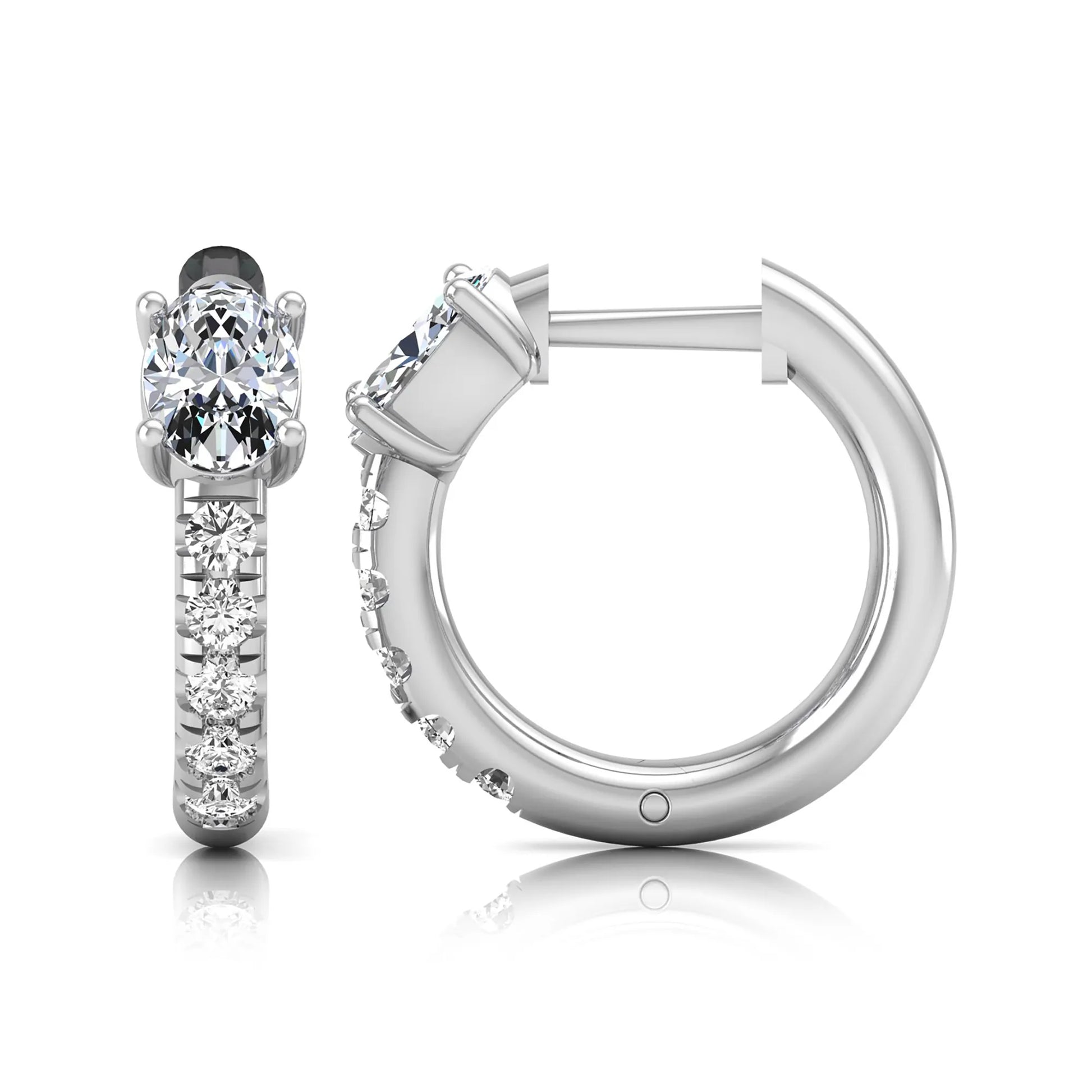 Oval cut lab grown diamond huggie hoop earrings featuring a four prong basket set center diamond with graduated round brilliant pavé diamonds on a white gold hoop.