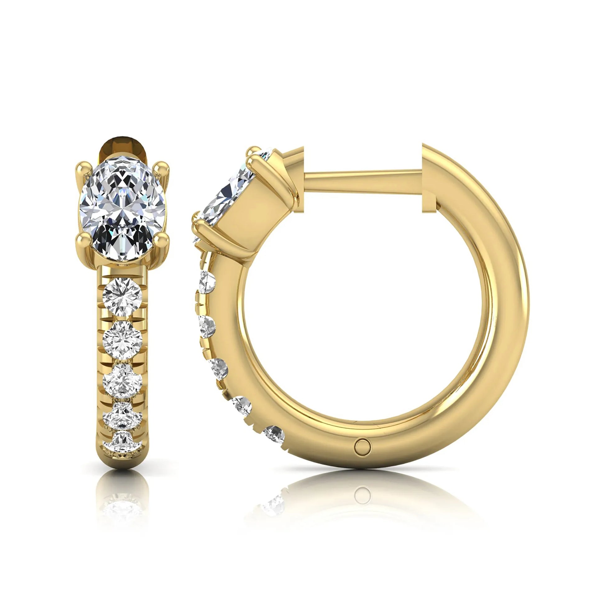 Oval cut lab grown diamond huggie hoop earrings featuring a four prong basket set center diamond with graduated round brilliant pavé diamonds on a yellow gold hoop.