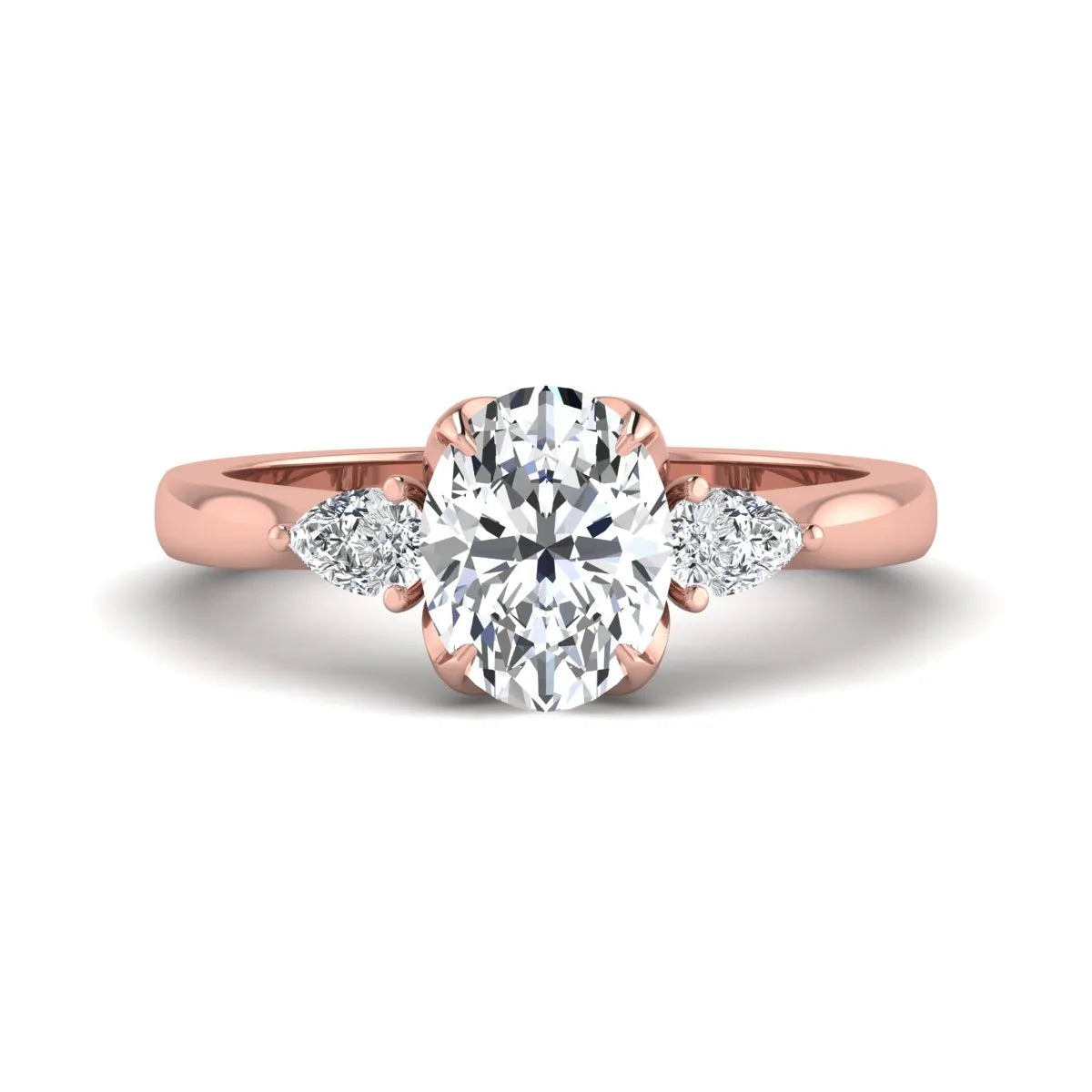 Oval & Pear Three Stone Lab Grown Diamond Engagement Ring featuring a 9.00 × 7.00 mm IGI Certified oval-cut center diamond with pear-cut side diamonds in rose gold.