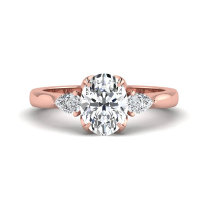 Oval & Pear Three Stone Lab Grown Diamond Engagement Ring featuring a 9.00 × 7.00 mm IGI Certified oval-cut center diamond with pear-cut side diamonds in rose gold.