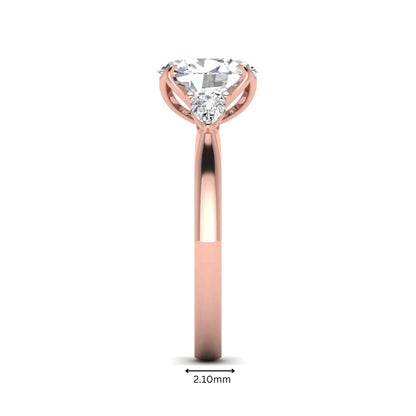 Oval & Pear Three Stone Lab Grown Diamond Engagement Ring featuring a 9.00 × 7.00 mm IGI Certified oval-cut center diamond with pear-cut side diamonds in rose gold.