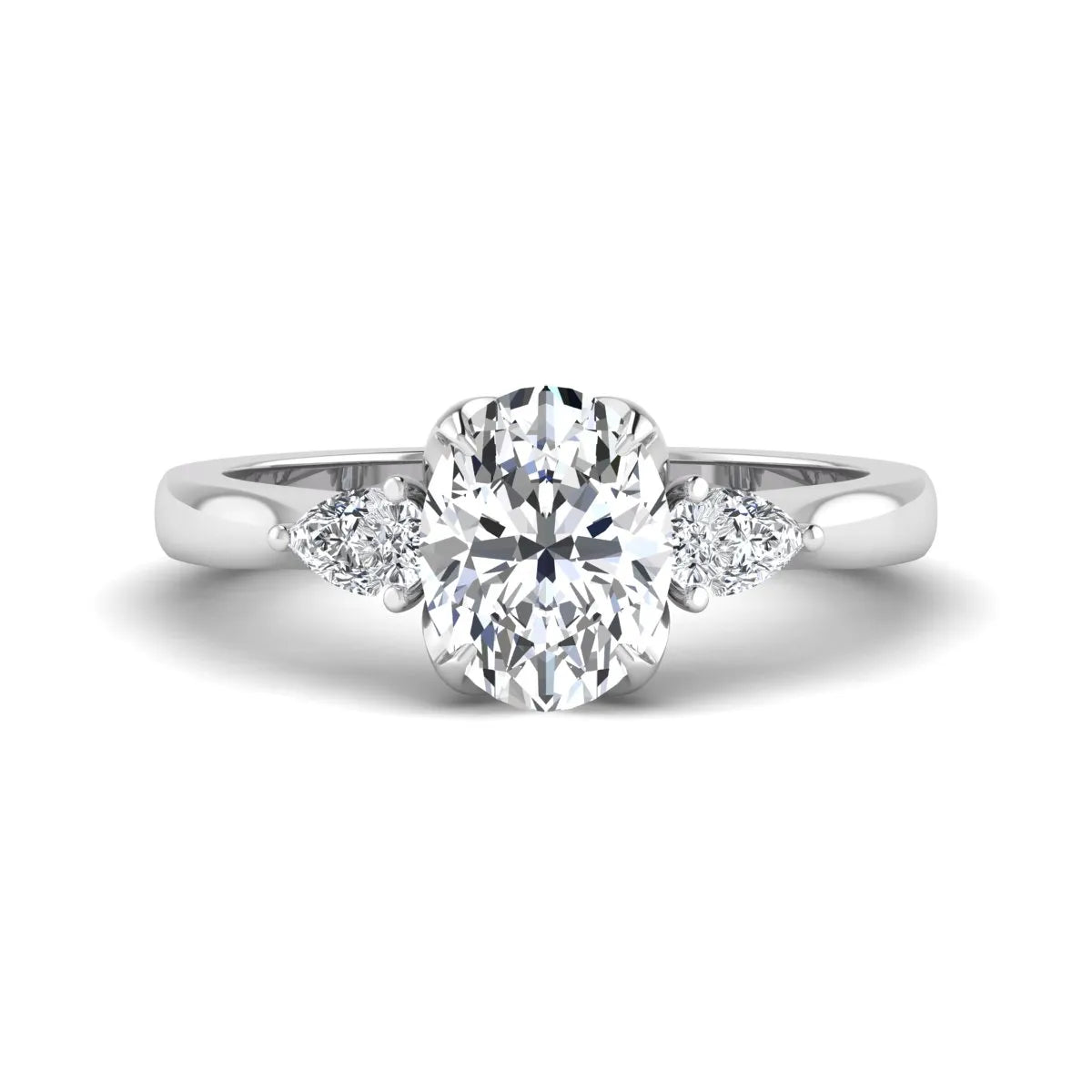 Oval & Pear Three Stone Lab Grown Diamond Engagement Ring featuring a 9.00 × 7.00 mm IGI Certified oval-cut center diamond with pear-cut side diamonds in white gold.