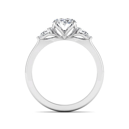 Oval & Pear Three Stone Lab Grown Diamond Engagement Ring featuring a 9.00 × 7.00 mm IGI Certified oval-cut center diamond with pear-cut side diamonds in white gold.
