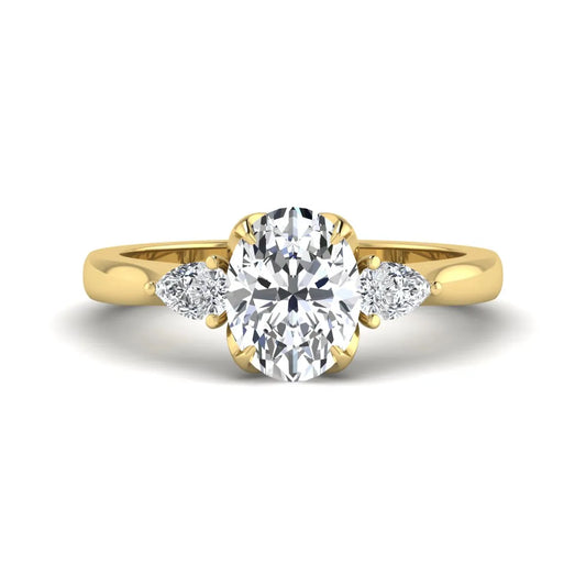 Oval & Pear Three Stone Lab Grown Diamond Engagement Ring featuring a 9.00 × 7.00 mm IGI Certified oval-cut center diamond with pear-cut side diamonds in yellow gold.