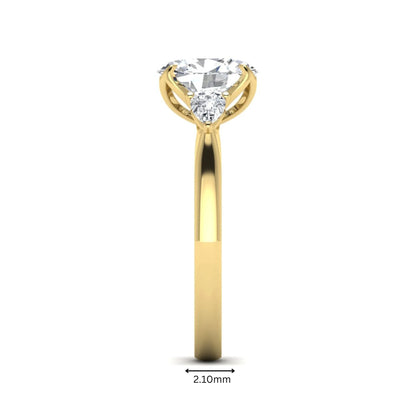 Oval & Pear Three Stone Lab Grown Diamond Engagement Ring featuring a 9.00 × 7.00 mm IGI Certified oval-cut center diamond with pear-cut side diamonds in yellow gold.