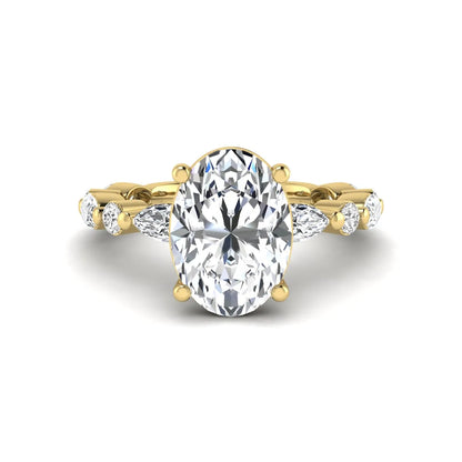 Oval prong set lab grown diamond engagement ring featuring a 2.50 carat oval center diamond with marquise and round accent diamonds in yellow gold finish.