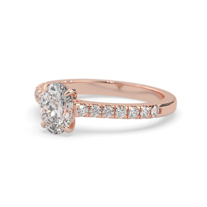 Oval cut lab grown diamond prong set engagement ring with pavé band and rose gold  metal tone design