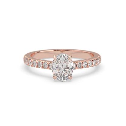 Oval cut lab grown diamond prong set engagement ring with pavé band and rose gold  metal tone design
