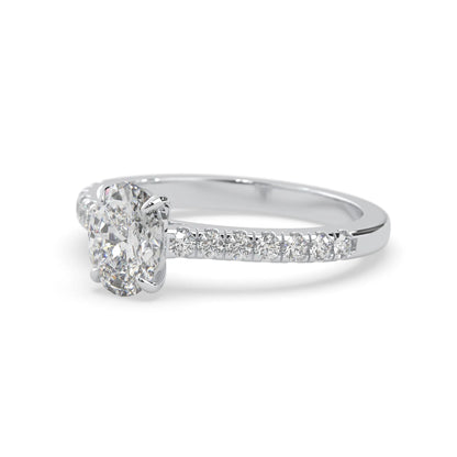 Oval cut lab grown diamond prong set engagement ring with pavé band and white gold  metal tone design