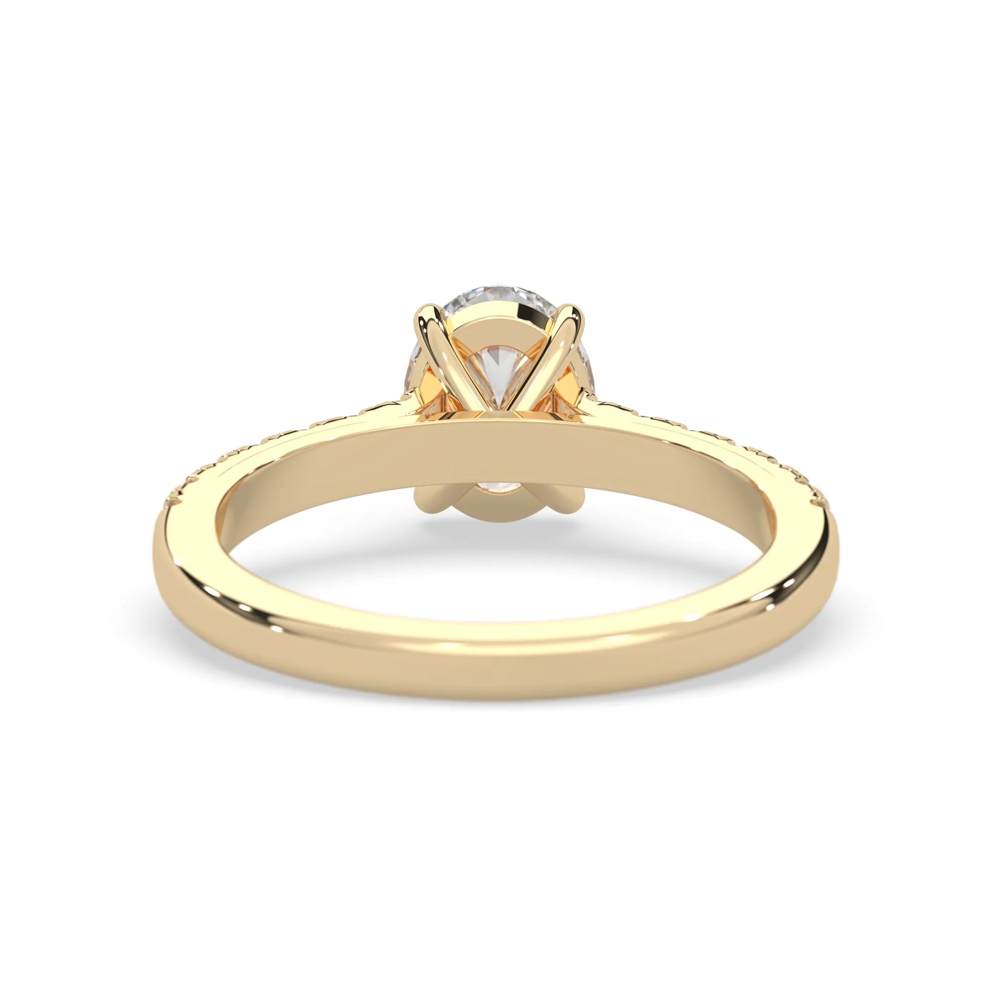 Oval cut lab grown diamond prong set engagement ring with pavé band and yellow gold  metal tone design