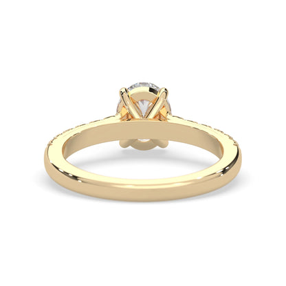 Oval cut lab grown diamond prong set engagement ring with pavé band and yellow gold  metal tone design