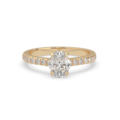 Oval cut lab grown diamond prong set engagement ring with pavé band and yellow gold  metal tone design