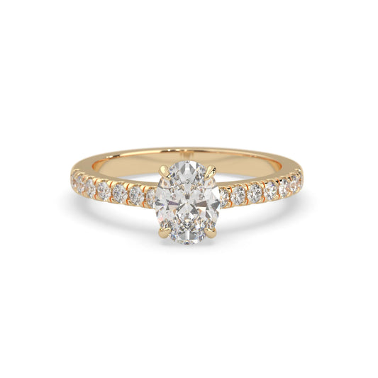 Oval cut lab grown diamond prong set engagement ring with pavé band and yellow gold  metal tone design