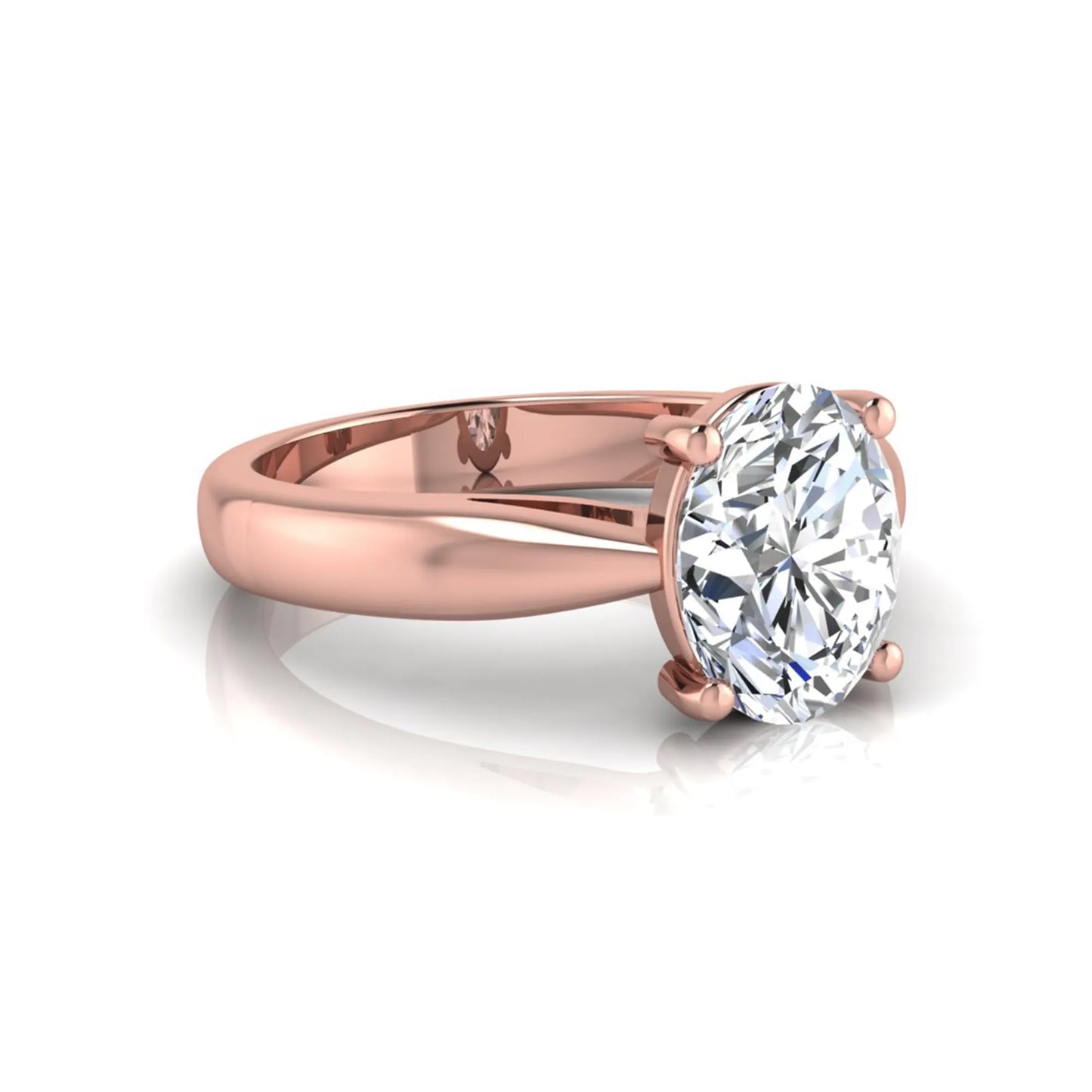 Oval cut lab grown diamond solitaire engagement ring with a four prong setting and rose gold tone band.
