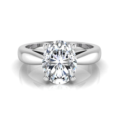 Oval cut lab grown diamond solitaire engagement ring with a four prong setting and white gold tone band.