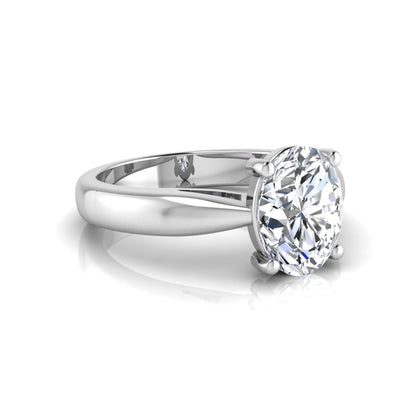 Oval cut lab grown diamond solitaire engagement ring with a four prong setting and white gold tone band.