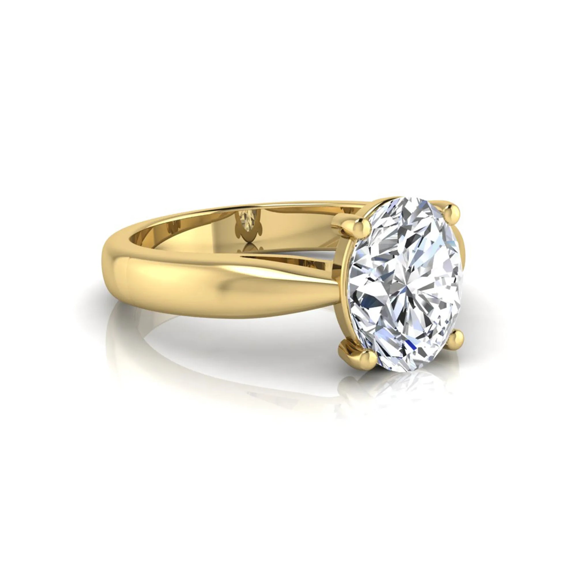 Oval cut lab grown diamond solitaire engagement ring with a four prong setting and yellow gold tone band.