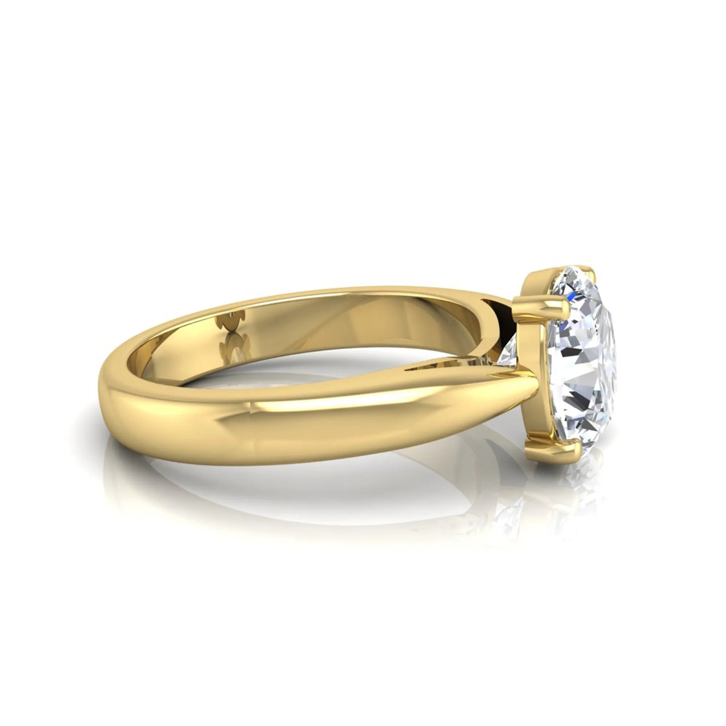 Oval cut lab grown diamond solitaire engagement ring with a four prong setting and yellow gold tone band.