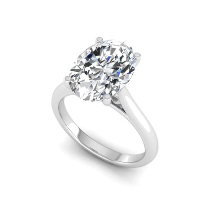 Oval cut lab grown diamond solitaire engagement ring with classic prong setting and white gold tone shown for design reference.