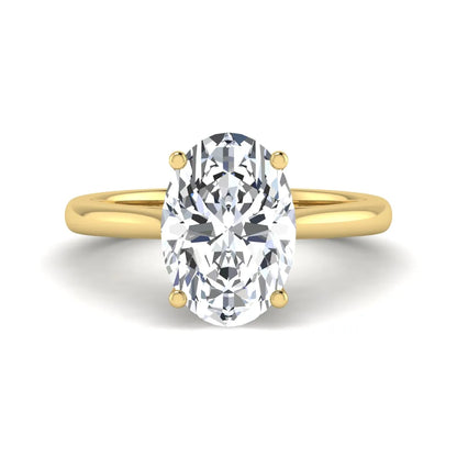 Oval cut lab grown diamond solitaire engagement ring with classic prong setting and yellow gold tone shown for design reference.