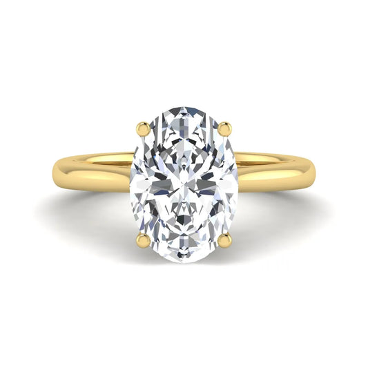 Oval cut lab grown diamond solitaire engagement ring with classic prong setting and yellow gold tone shown for design reference.