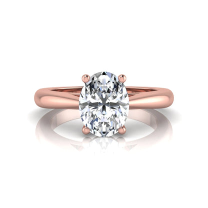 Oval cut lab grown diamond solitaire engagement ring featuring a classic four-prong setting with a polished rose gold cathedral-style band.