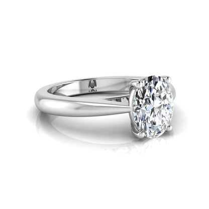 Oval cut lab grown diamond solitaire engagement ring featuring a classic four-prong setting with a polished white gold cathedral-style band.