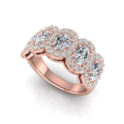 Oval and round cut lab grown diamond halo band ring featuring multiple oval diamonds with sparkling round halo accents in rose gold design