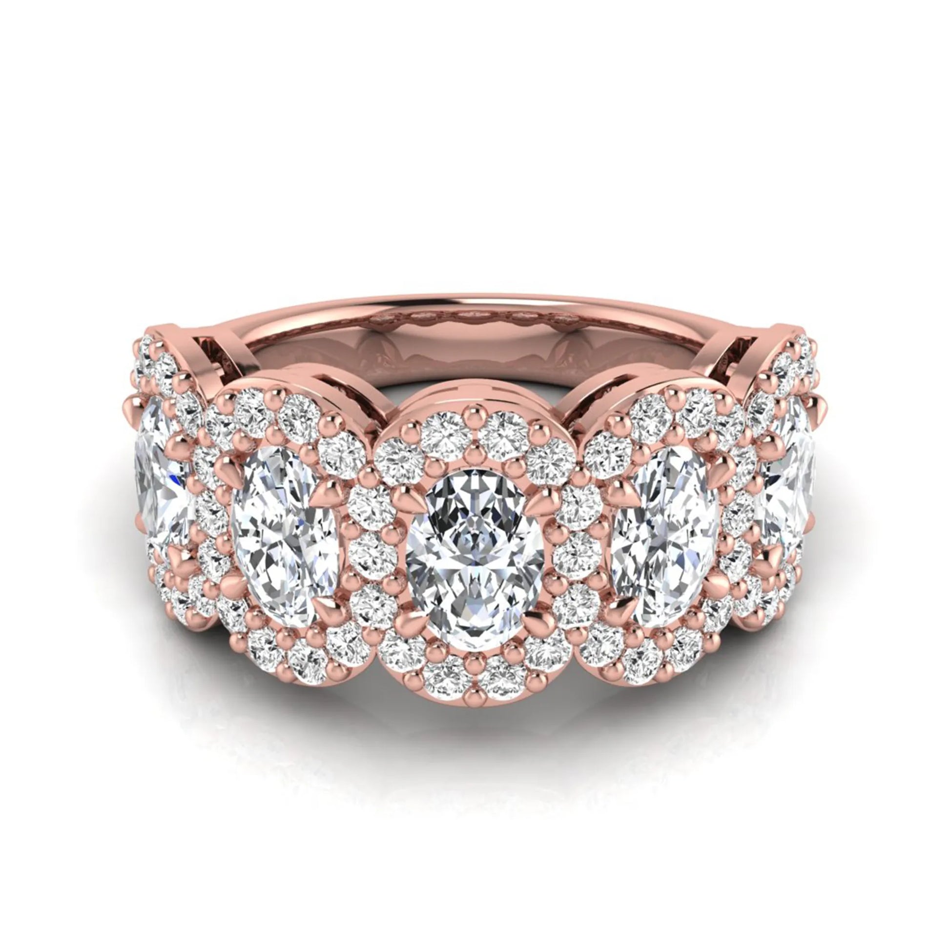 Oval and round cut lab grown diamond halo band ring featuring multiple oval diamonds with sparkling round halo accents in rose gold design