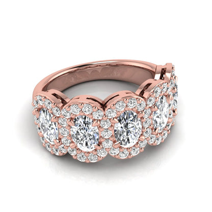 Oval and round cut lab grown diamond halo band ring featuring multiple oval diamonds with sparkling round halo accents in rose gold design