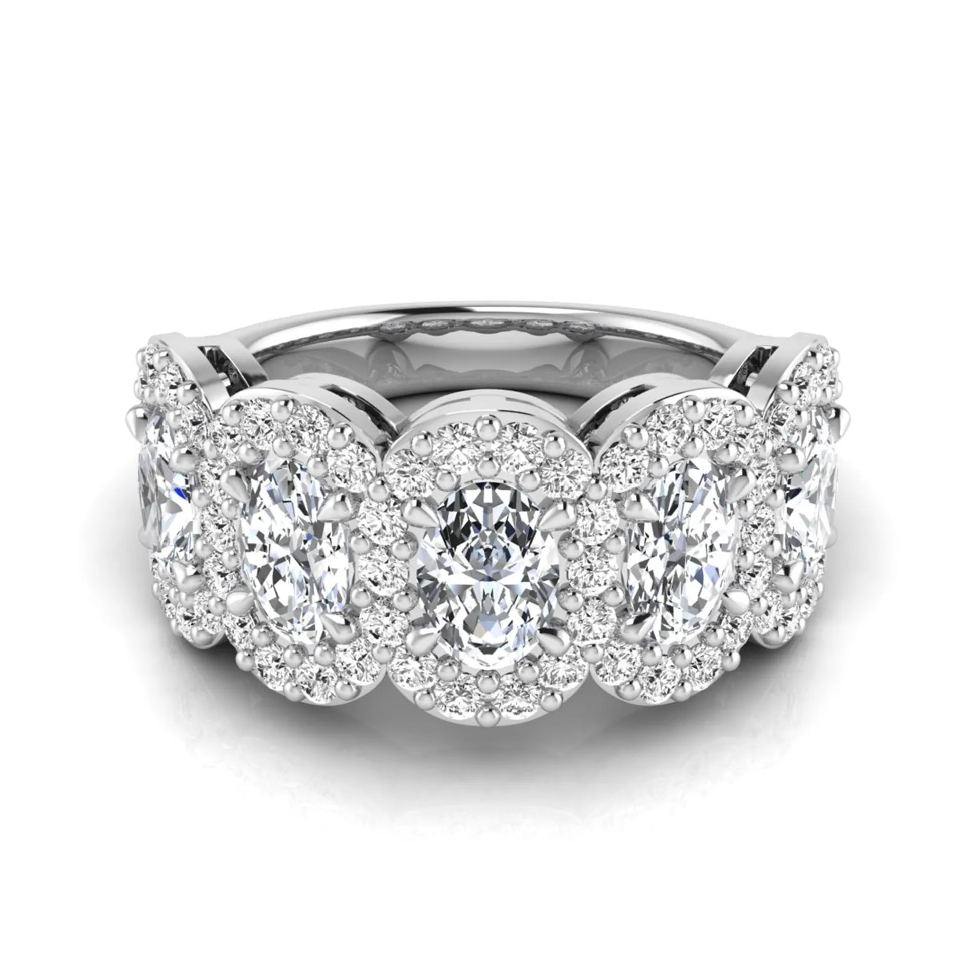 Oval and round cut lab grown diamond halo band ring featuring multiple oval diamonds with sparkling round halo accents in white gold design