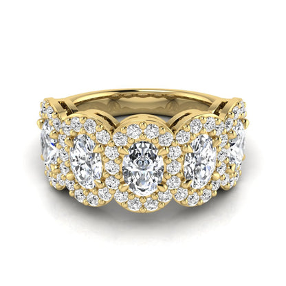 Oval and round cut lab grown diamond halo band ring featuring multiple oval diamonds with sparkling round halo accents in yellow gold design