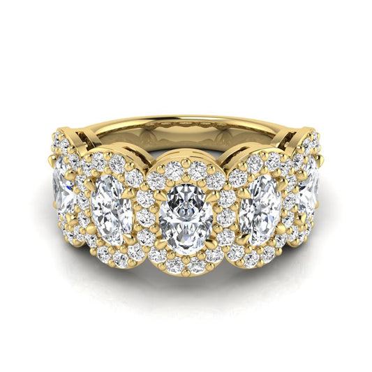 Oval and round cut lab grown diamond halo band ring featuring multiple oval diamonds with sparkling round halo accents in yellow gold design