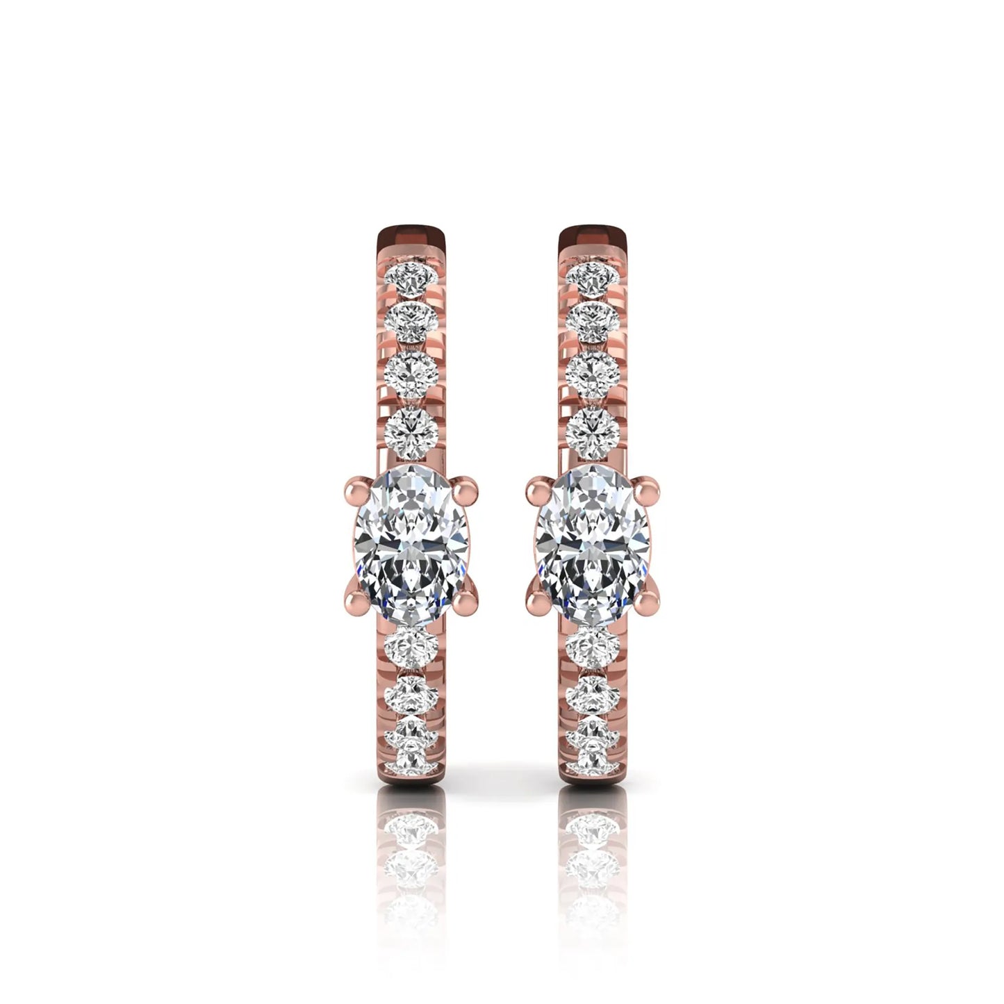 Oval and round lab grown diamond pavé huggie hoop earrings featuring a four prong oval center diamond with graduated shared prong round diamond accents in rose gold.