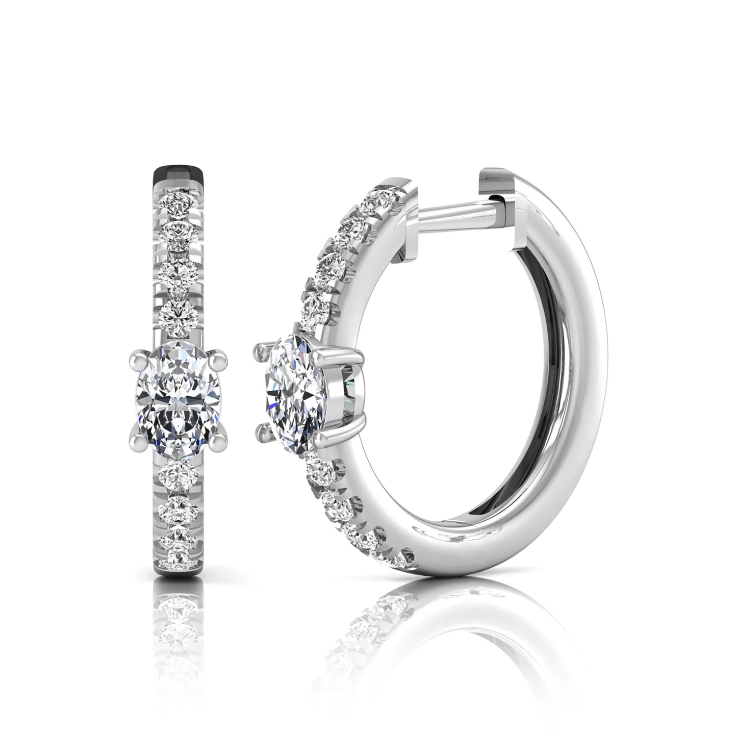 Oval and round lab grown diamond pavé huggie hoop earrings featuring a four prong oval center diamond with graduated shared prong round diamond accents in white gold.