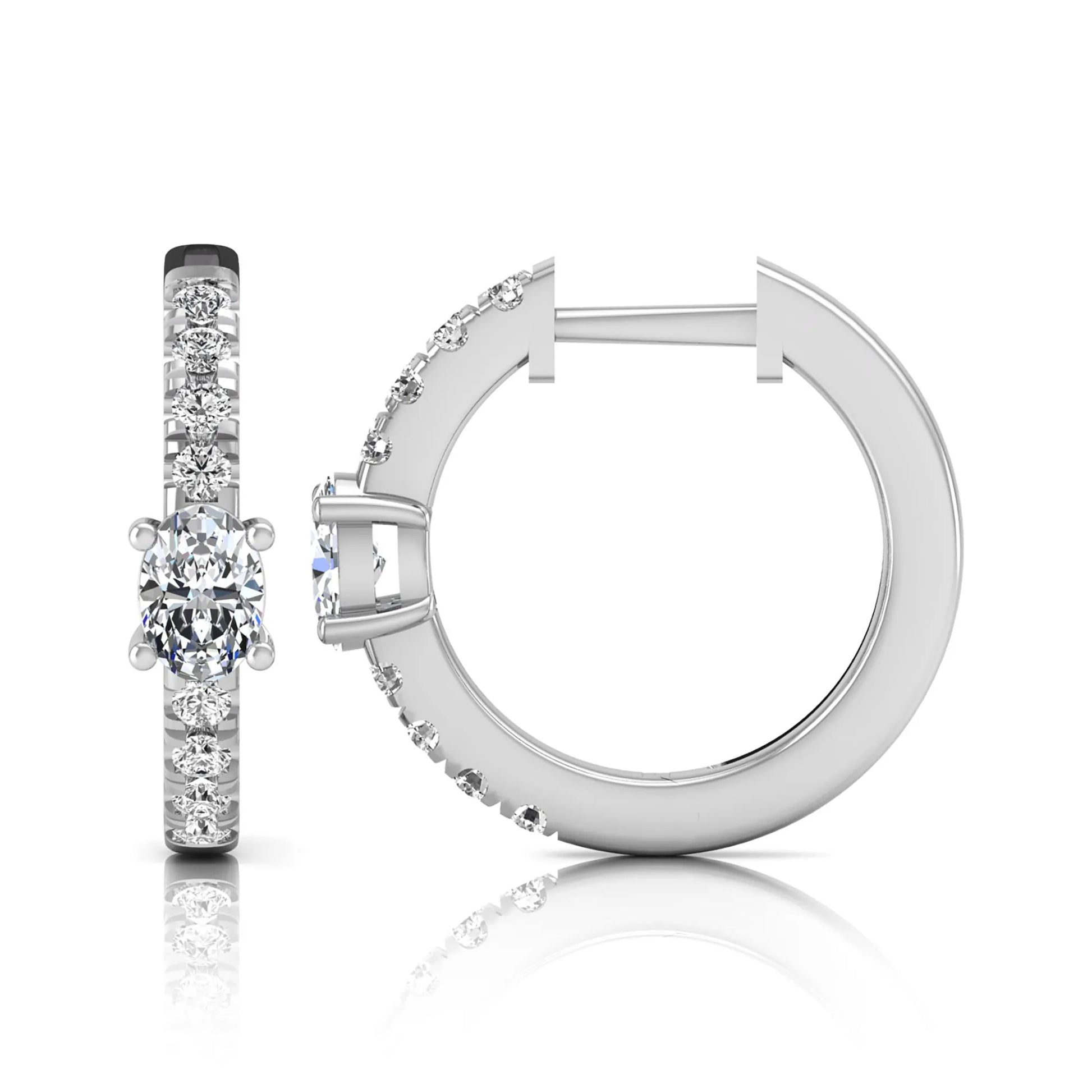Oval and round lab grown diamond pavé huggie hoop earrings featuring a four prong oval center diamond with graduated shared prong round diamond accents in white gold.