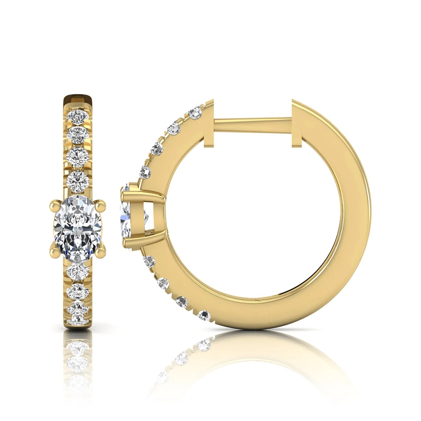 Oval and round lab grown diamond pavé huggie hoop earrings featuring a four prong oval center diamond with graduated shared prong round diamond accents in yellow gold.