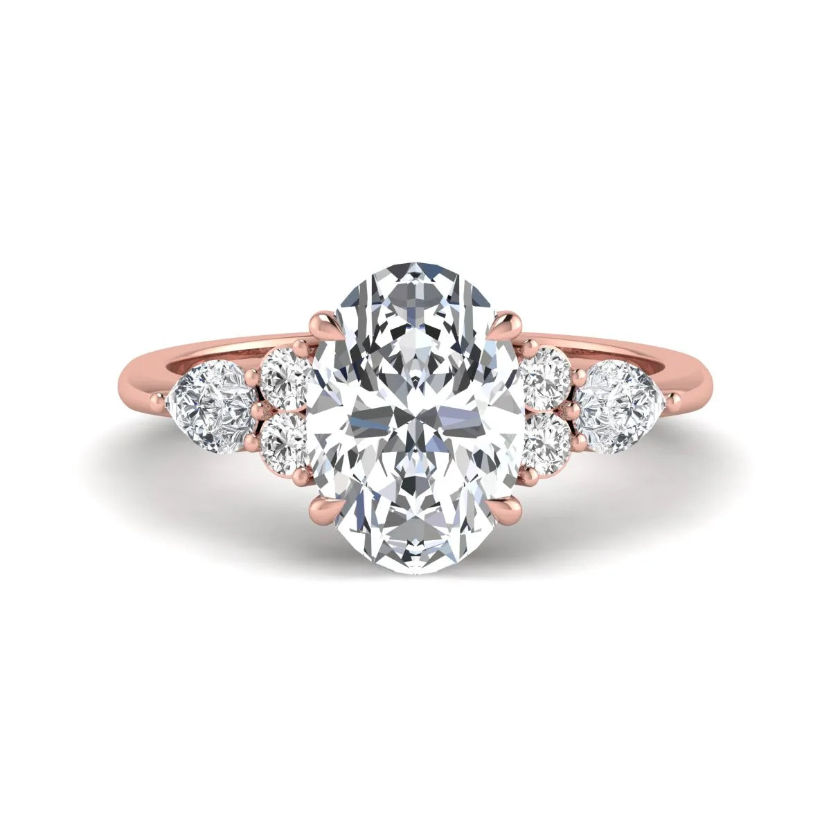 Oval Seven Stone Lab Grown Diamond Engagement Ring featuring a 10.00 × 7.00 mm oval-cut center diamond with round and pear-cut side diamonds in a multi-prong setting in rose gold