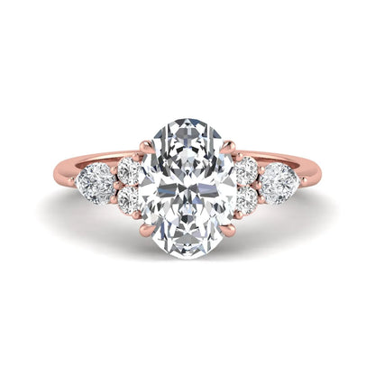 Oval Seven Stone Lab Grown Diamond Engagement Ring featuring a 10.00 × 7.00 mm oval-cut center diamond with round and pear-cut side diamonds in a multi-prong setting in rose gold